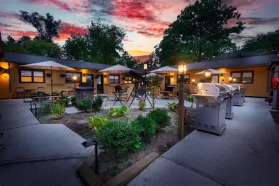 Wide courtyard at sunset, doors open