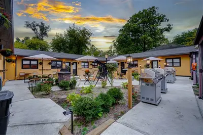 Yellow cabins at daytime, doors painted teal