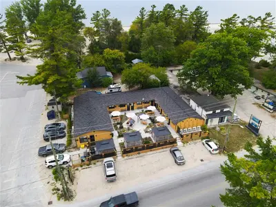 Aerial of the property with the beach beyond