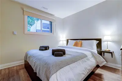 Modern white bedroom in the Two Bedroom Suite