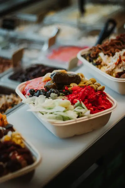 Vegan bowl with dolma, olives, lettuce, peppers