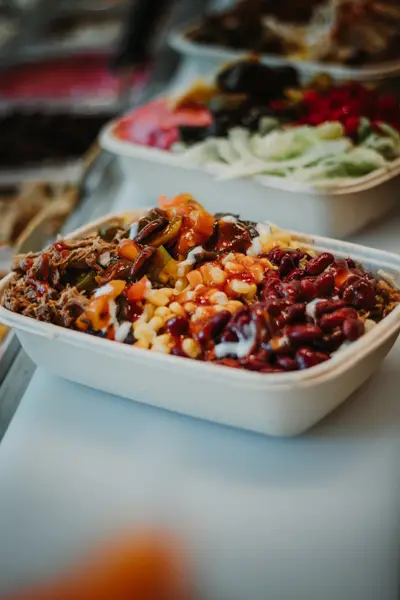 Bowl with pulled meat, beans, corn, salsa