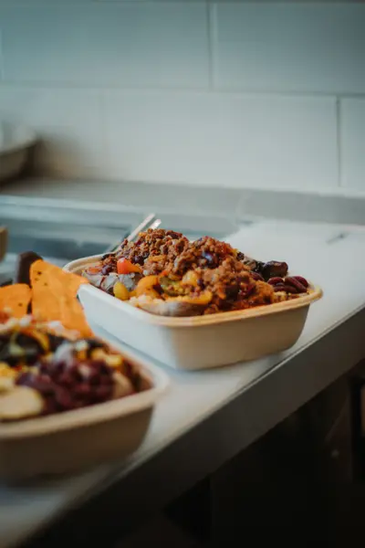 Kitchen pass with chili bowl and tortilla chips