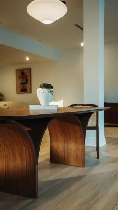 Walnut arch dining table, book-matched top.