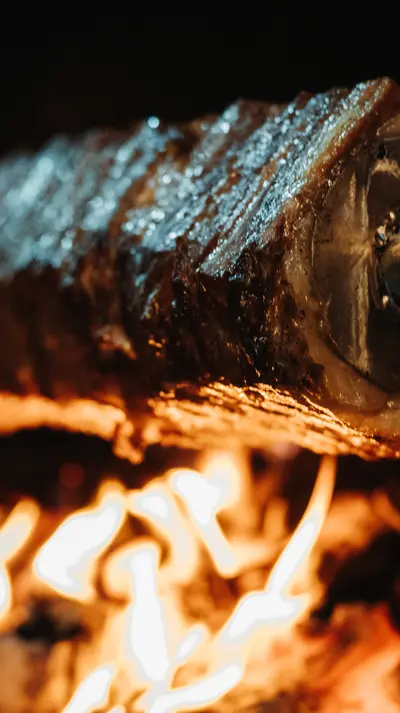 A fish, bound for embers — flame around the cheek