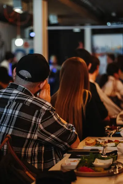 Guests eating and talking at the table