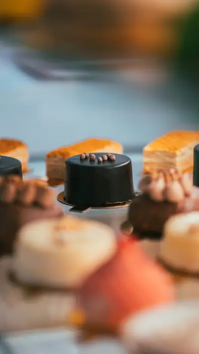 An assortment of small cakes on the production rack