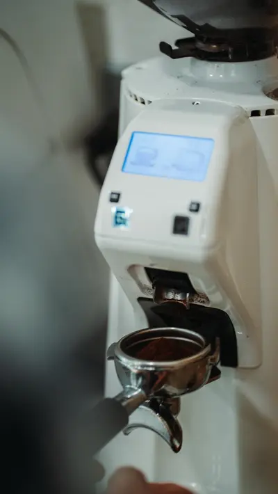 A portafilter under the grinder spout