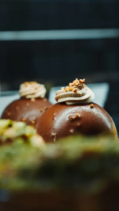 Two glazed domes above a pistachio-green layer