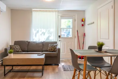 A sofa and small dining set in a single room