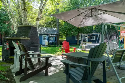 Adirondack chairs and a parasol on the patio