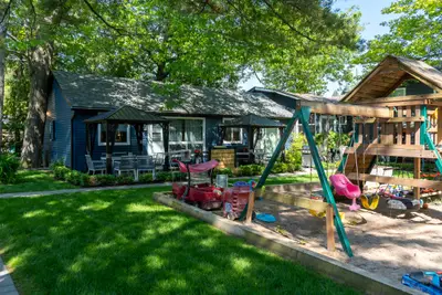 Cabins and the playground seen across the lawn