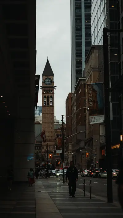 A downtown street leading toward the old clock tower