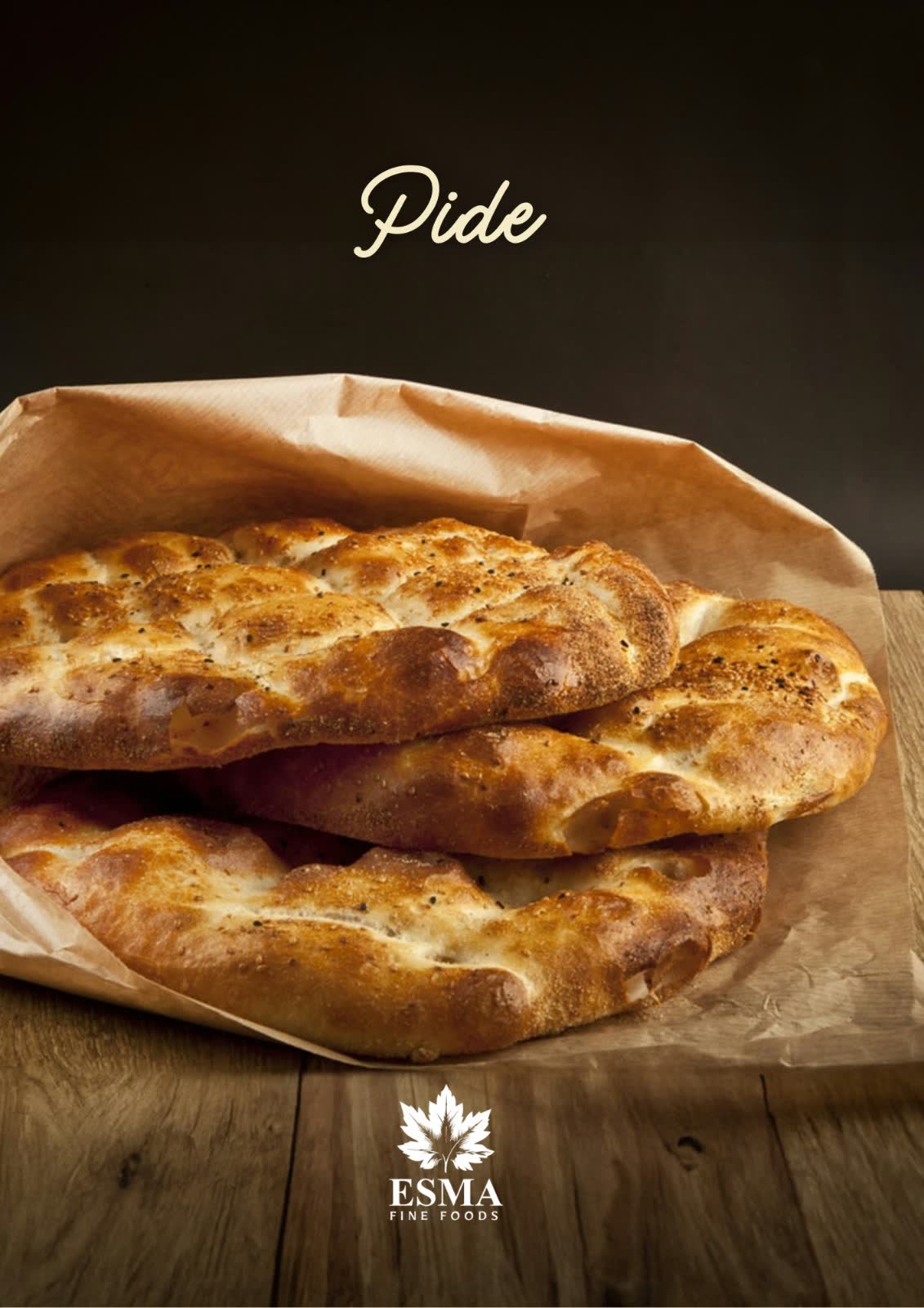 Ramazan pide loaves in a brown paper bag on a wooden table, dark background
